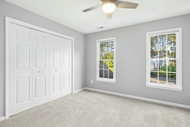 102 Cockleshell Ct, Cary, NC 27513 - unfurnished bedroom featuring a closet, carpet flooring, baseboards, and multiple windows