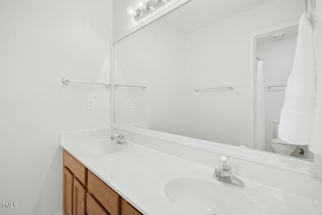 102 Cockleshell Ct, Cary, NC 27513 - bathroom with a sink, toilet, and double vanity