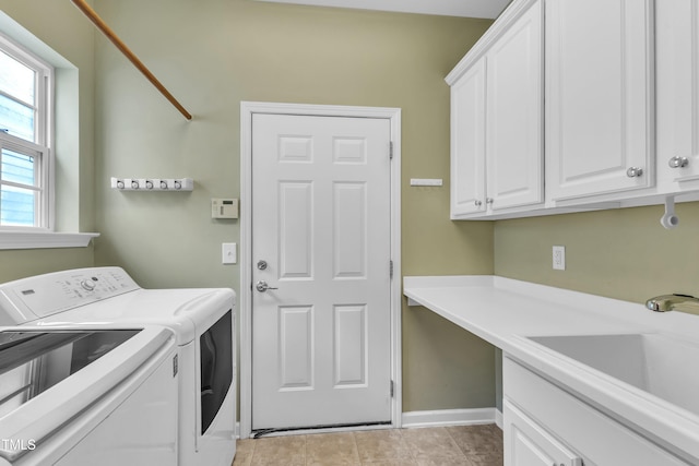 113 Dowington Ln, Cary, NC 27519 - washroom with cabinet space, washing machine and dryer, baseboards, a desk, and light tile patterned floors