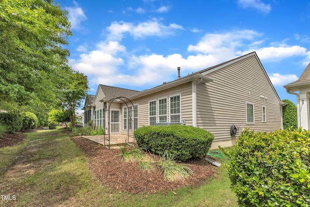 113 Dowington Ln, Cary, NC 27519 - view of side of home featuring a patio area and a yard