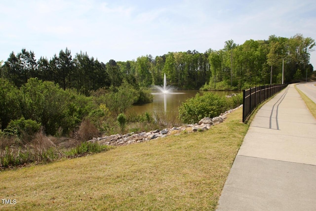 113 Dowington Ln, Cary, NC 27519 - view of community with a water view, a lawn, and a view of trees