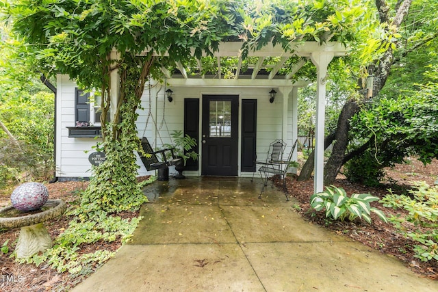 doorway to property with a porch