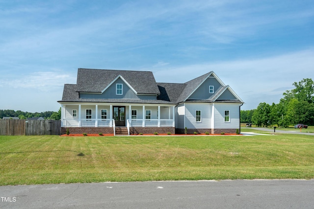view of front of house with covered porch and roof with shingles