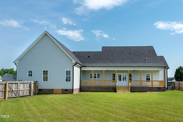 back of property with crawl space, roof with shingles, a ceiling fan, and french doors