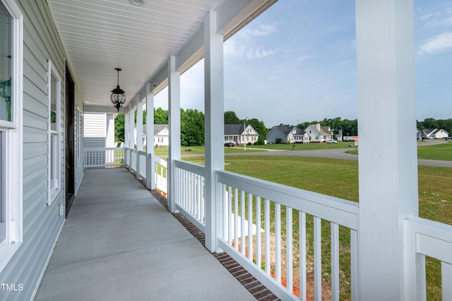 view of patio / terrace featuring a porch and a residential view