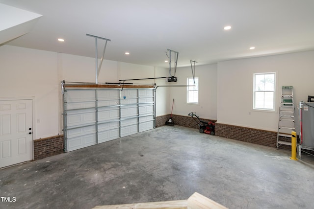 garage featuring a garage door opener and recessed lighting