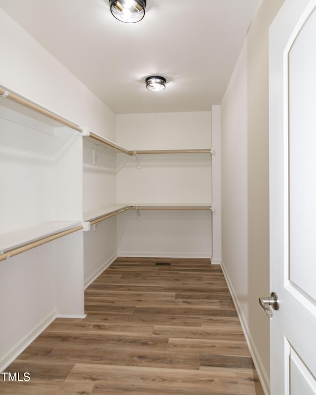 walk in closet featuring light wood-style flooring