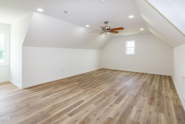 bonus room with lofted ceiling, light wood finished floors, ceiling fan, baseboards, and recessed lighting