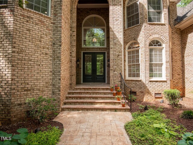 540 Vista Del Lago Ln, Wake Forest, NC 27587 - view of exterior entry with french doors and brick siding