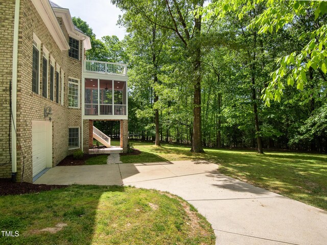 540 Vista Del Lago Ln, Wake Forest, NC 27587 - view of green lawn featuring a sunroom, stairway, and a balcony