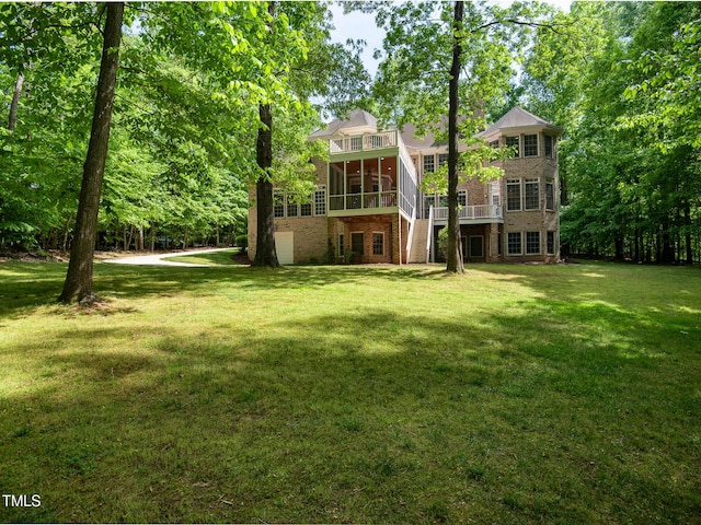 540 Vista Del Lago Ln, Wake Forest, NC 27587 - back of house with a sunroom, brick siding, and a lawn
