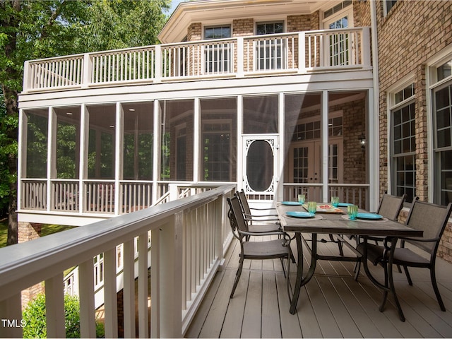 540 Vista Del Lago Ln, Wake Forest, NC 27587 - deck featuring a sunroom and outdoor dining area