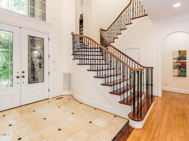 540 Vista Del Lago Ln, Wake Forest, NC 27587 - foyer entrance with stairway, arched walkways, baseboards, recessed lighting, and crown molding