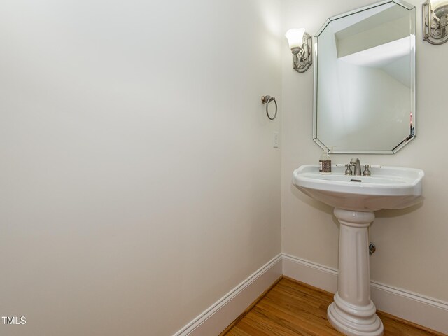 540 Vista Del Lago Ln, Wake Forest, NC 27587 - bathroom with baseboards and wood finished floors