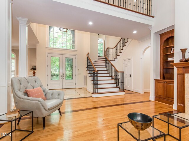 540 Vista Del Lago Ln, Wake Forest, NC 27587 - foyer featuring a towering ceiling, arched walkways, stairs, hardwood / wood-style flooring, and baseboards