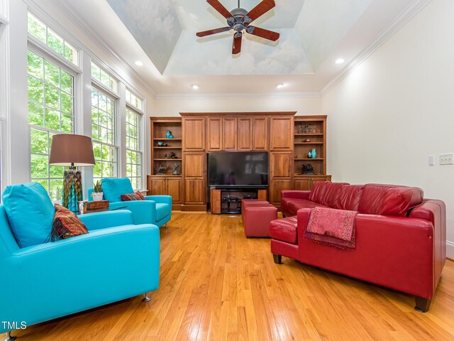 540 Vista Del Lago Ln, Wake Forest, NC 27587 - living room with light wood-type flooring, ceiling fan, a raised ceiling, and crown molding