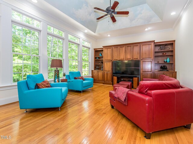 540 Vista Del Lago Ln, Wake Forest, NC 27587 - living room with light wood-style floors, a raised ceiling, a ceiling fan, crown molding, and recessed lighting