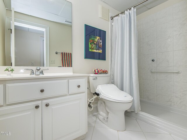 540 Vista Del Lago Ln, Wake Forest, NC 27587 - full bath featuring vanity, tile patterned floors, toilet, and tiled shower