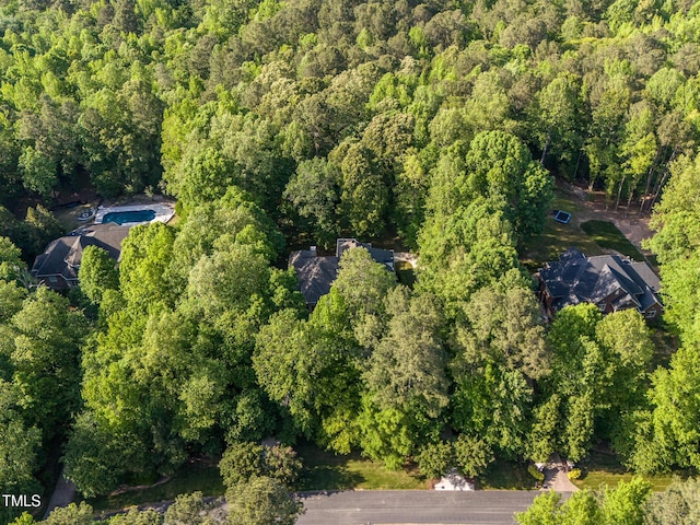 540 Vista Del Lago Ln, Wake Forest, NC 27587 - aerial view of property and surrounding area featuring a heavily wooded area