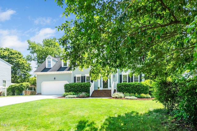 view of front facade with a garage, concrete driveway, and a front lawn