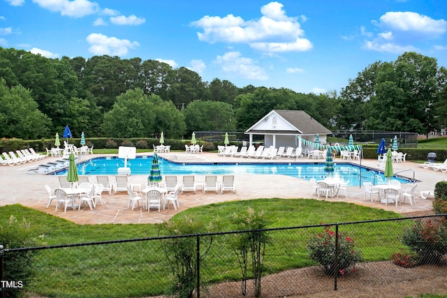 community pool featuring a patio area