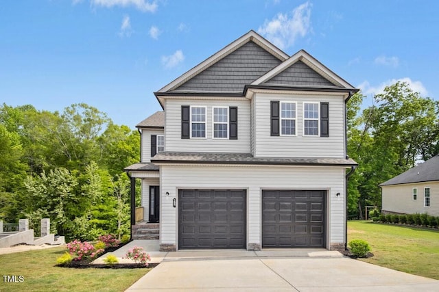 craftsman inspired home featuring driveway, a front lawn, and a garage