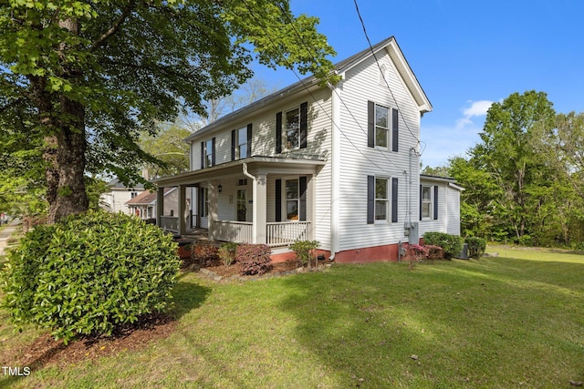 exterior space featuring a porch and a yard