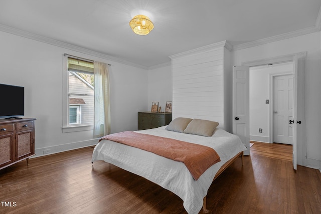 bedroom with baseboards, dark wood-style floors, and crown molding