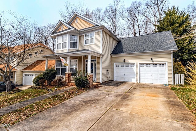 view of front of home featuring a porch, roof with shingles, a garage, and driveway
