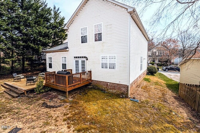 back of property featuring a deck