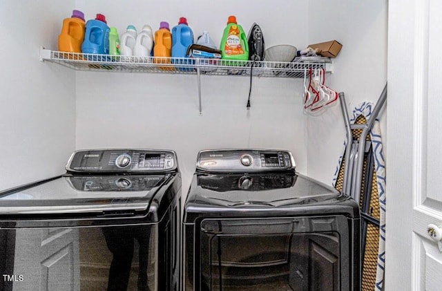 laundry area with washing machine and dryer and laundry area