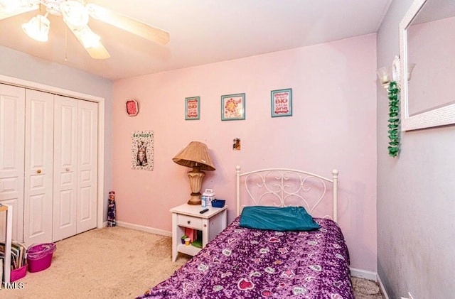 bedroom featuring a closet, baseboards, ceiling fan, and carpet