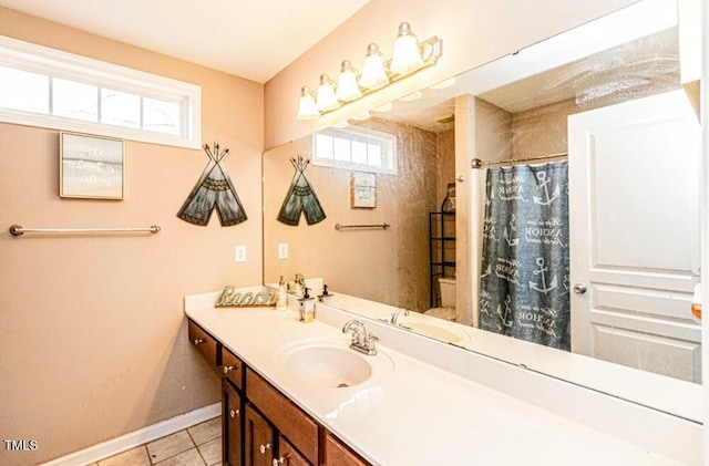 full bathroom with vanity, baseboards, tile patterned flooring, and a shower with curtain