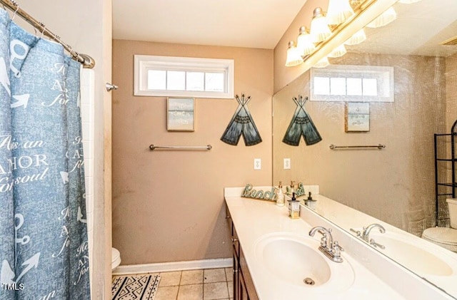 full bathroom featuring vanity, tile patterned flooring, toilet, curtained shower, and baseboards