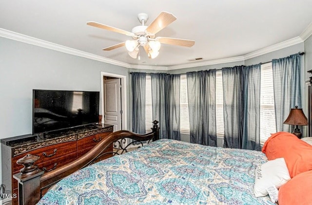 bedroom featuring visible vents, multiple windows, crown molding, and ceiling fan
