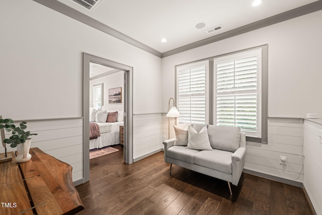 905 E Lenoir St, Raleigh, NC 27610 - living area featuring wainscoting, wood finished floors, and recessed lighting