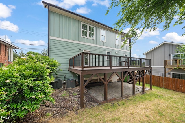 905 E Lenoir St, Raleigh, NC 27610 - back of property featuring board and batten siding, central AC, a deck, and a patio