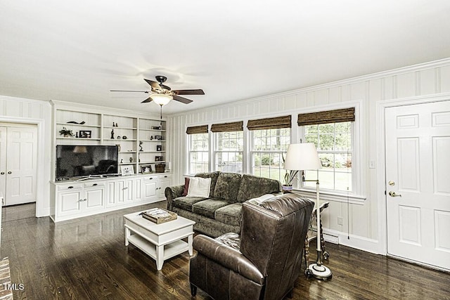 living room featuring crown molding, a ceiling fan, and plenty of natural light