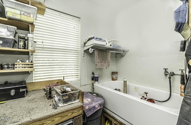 bathroom with a freestanding tub
