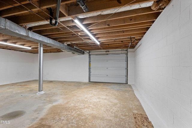 garage featuring concrete block wall