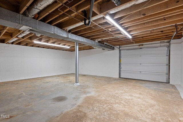 garage featuring concrete block wall