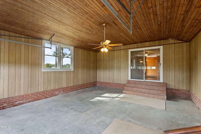 unfurnished sunroom featuring entry steps and ceiling fan