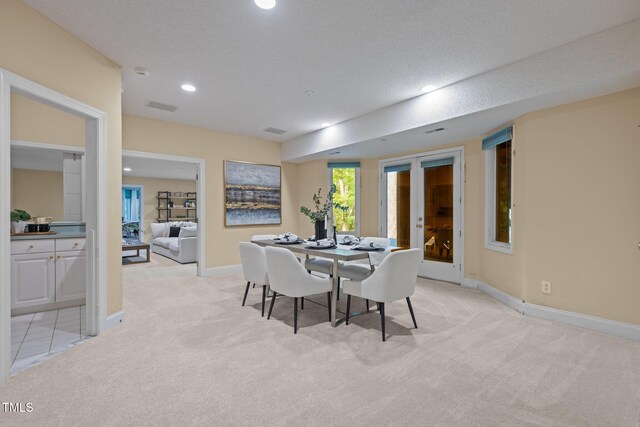 dining room with recessed lighting, visible vents, light carpet, and baseboards