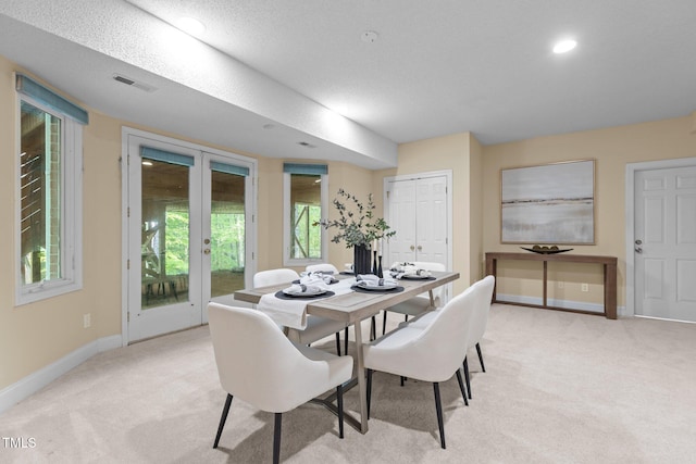 dining space featuring baseboards, visible vents, light colored carpet, and recessed lighting