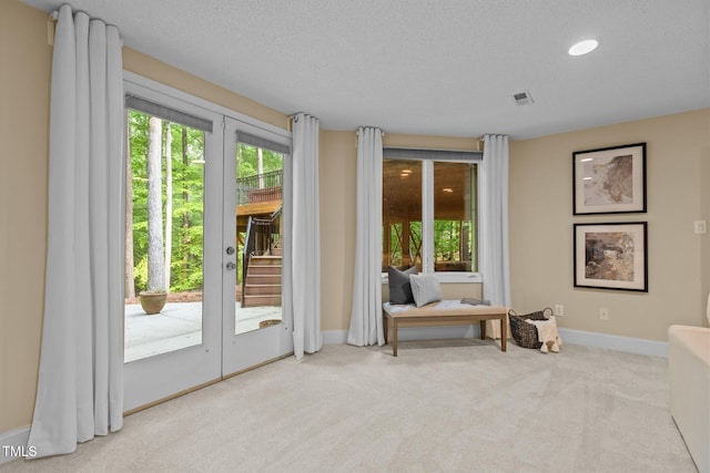 doorway with carpet, a healthy amount of sunlight, recessed lighting, and baseboards