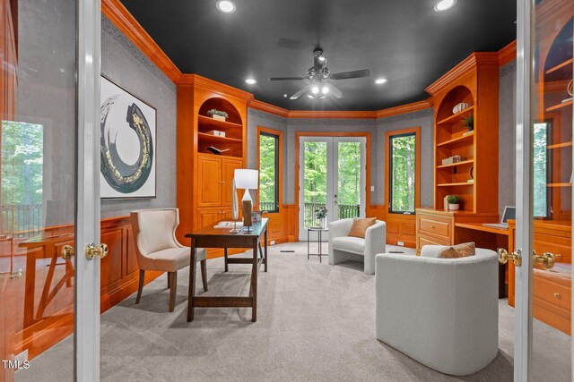 sitting room with recessed lighting, crown molding, a ceiling fan, light carpet, and french doors