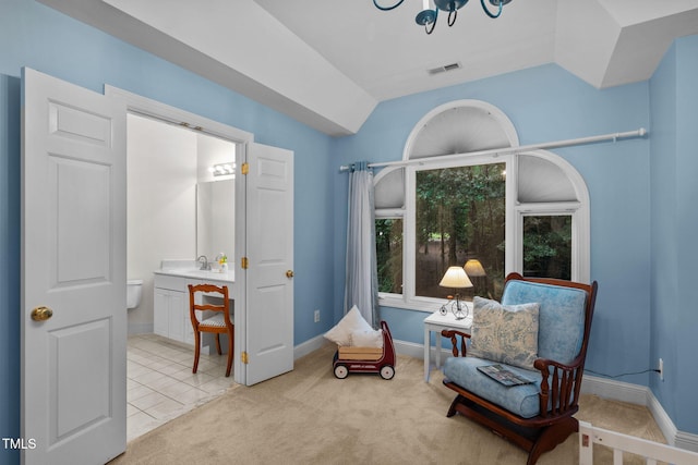 sitting room featuring visible vents, baseboards, vaulted ceiling, and light carpet