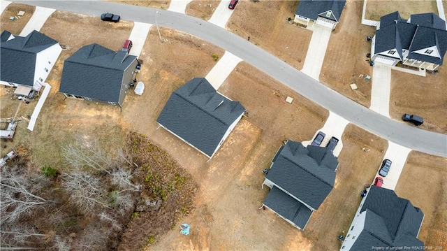 birds eye view of property with a residential view