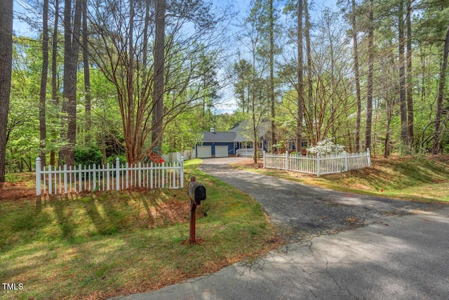 6321 Malvern Ln, Hillsborough, NC 27278 - view of front of home featuring asphalt driveway, a fenced front yard, and a garage