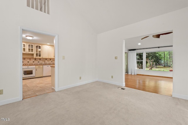 6321 Malvern Ln, Hillsborough, NC 27278 - unfurnished room with light colored carpet, a towering ceiling, and baseboards